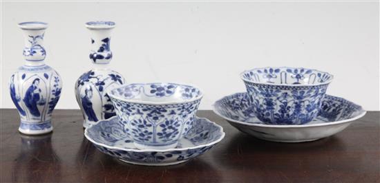 Two Chinese blue and white bottle vases and two similar teabowls and saucers, Kangxi period, ?cm